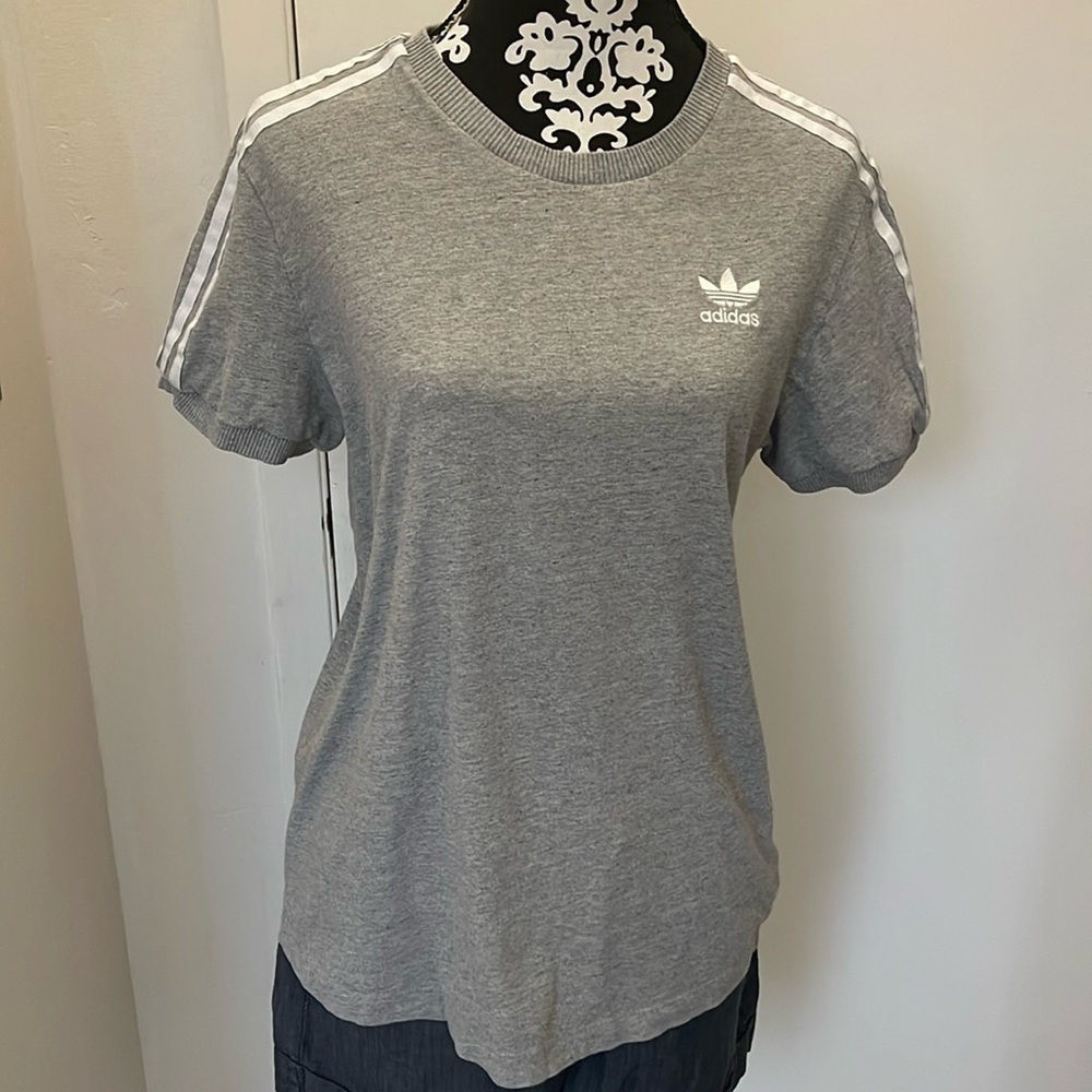 Adidas white embroidered label on gray shirt ribbon shoulders and sleeves